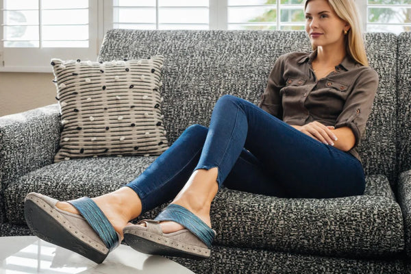 Argo-Grey_to_metallic_blue_lady_sitting_legs_crossed_on_couch_showing_Blue_Metallic